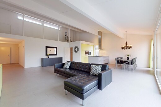 living / dining room with an inviting chandelier, high vaulted ceiling, and beamed ceiling