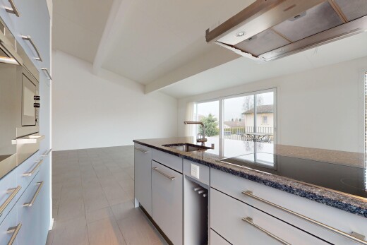 kitchen with sink, black electric stovetop, ventilation hood, light tile patterned flooring, and white cabinetry