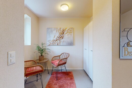 hall / corridor with light tile patterned floors