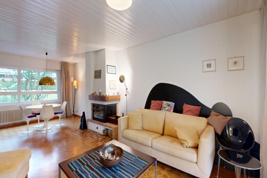 living / dining room featuring parquet floors