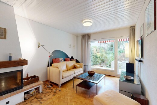 living area featuring parquet floors