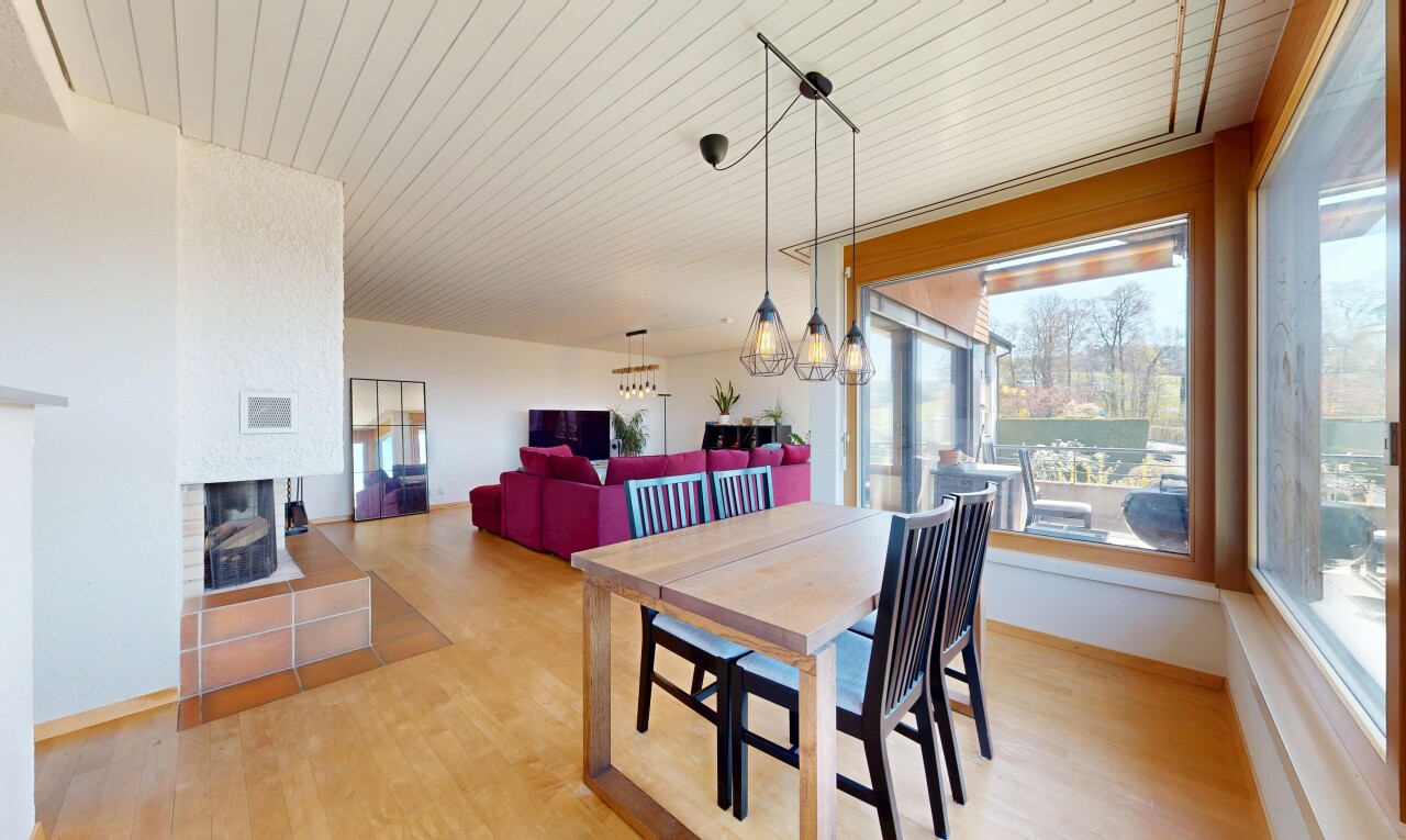 living / dining area featuring wooden ceiling, light wood-type flooring, a multi sided fireplace, and hanging lights