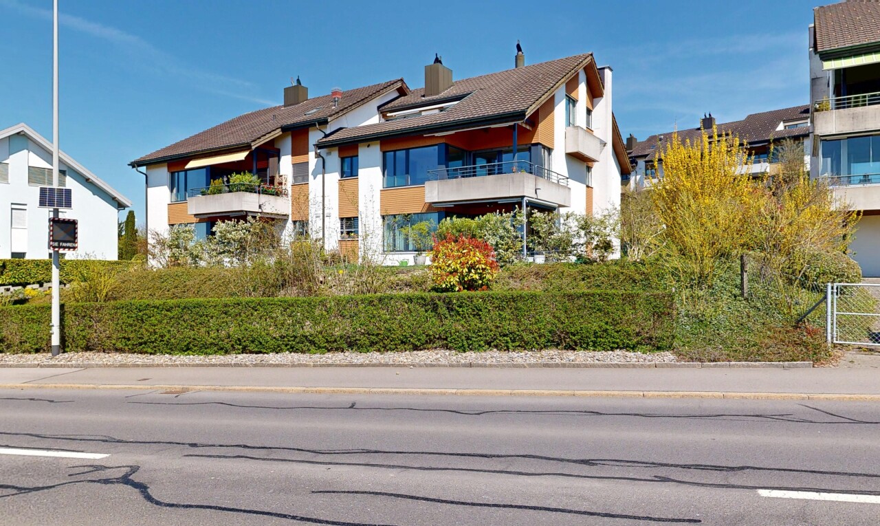 outdoor house with a balcony and a chimney