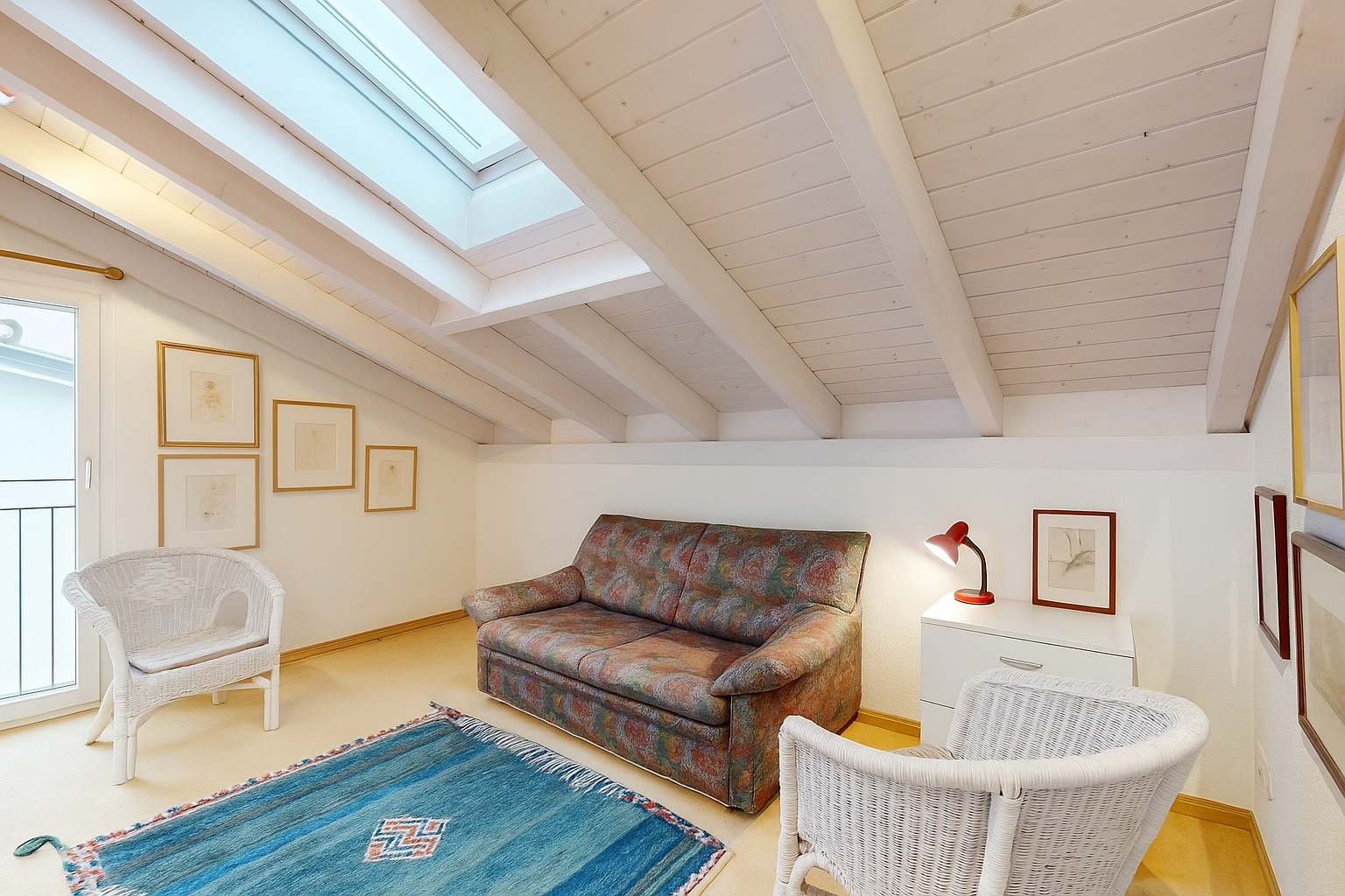 living room featuring a skylight
