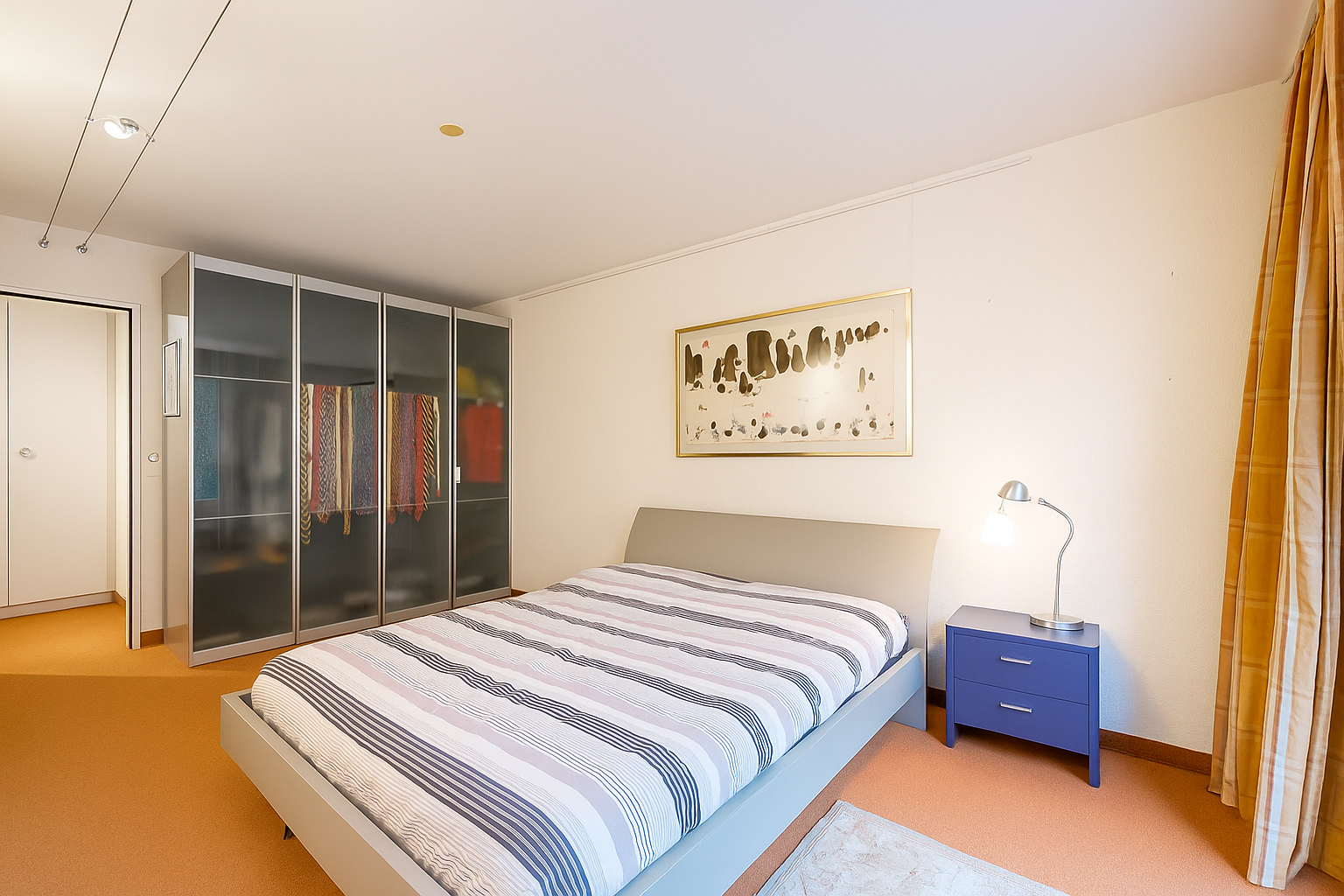 room featuring a closet and light colored carpet