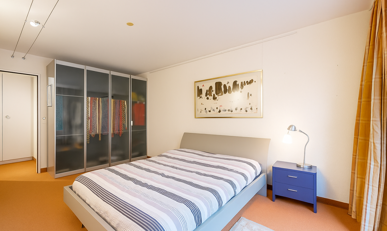 room featuring a closet and light colored carpet