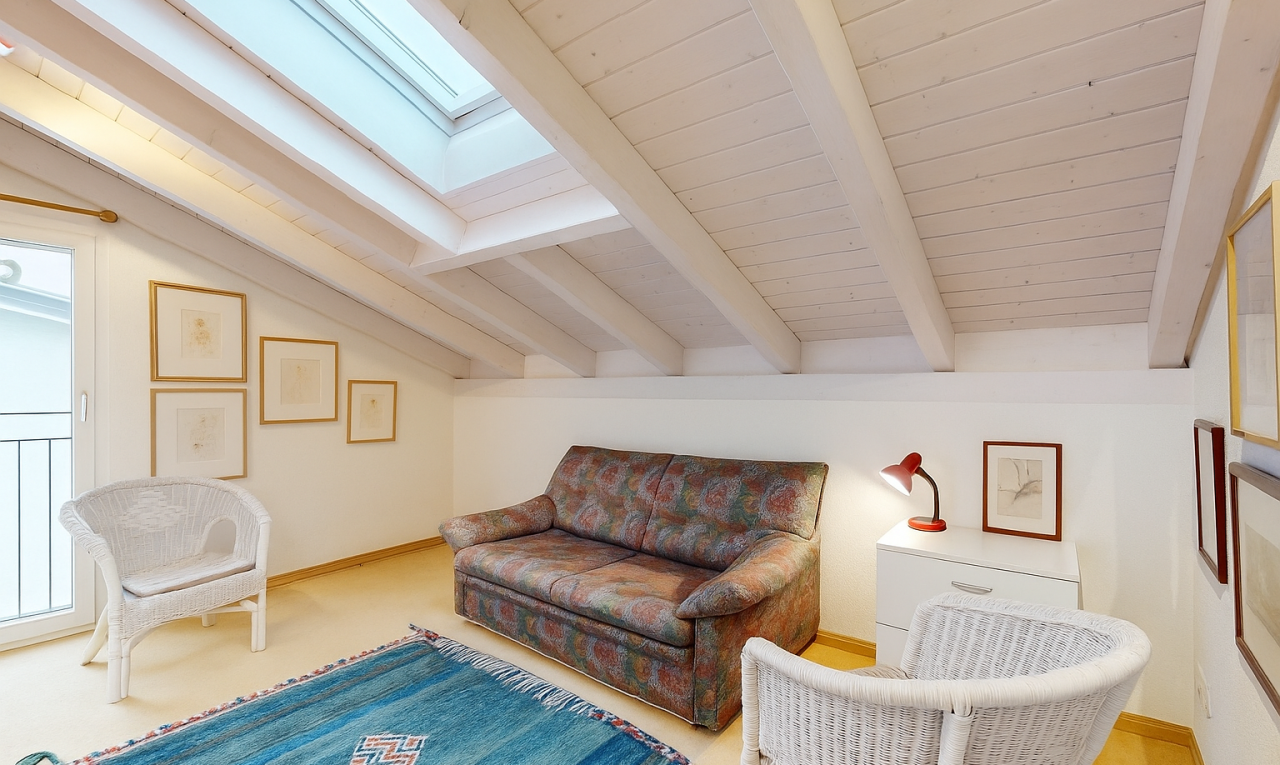 living room featuring a skylight