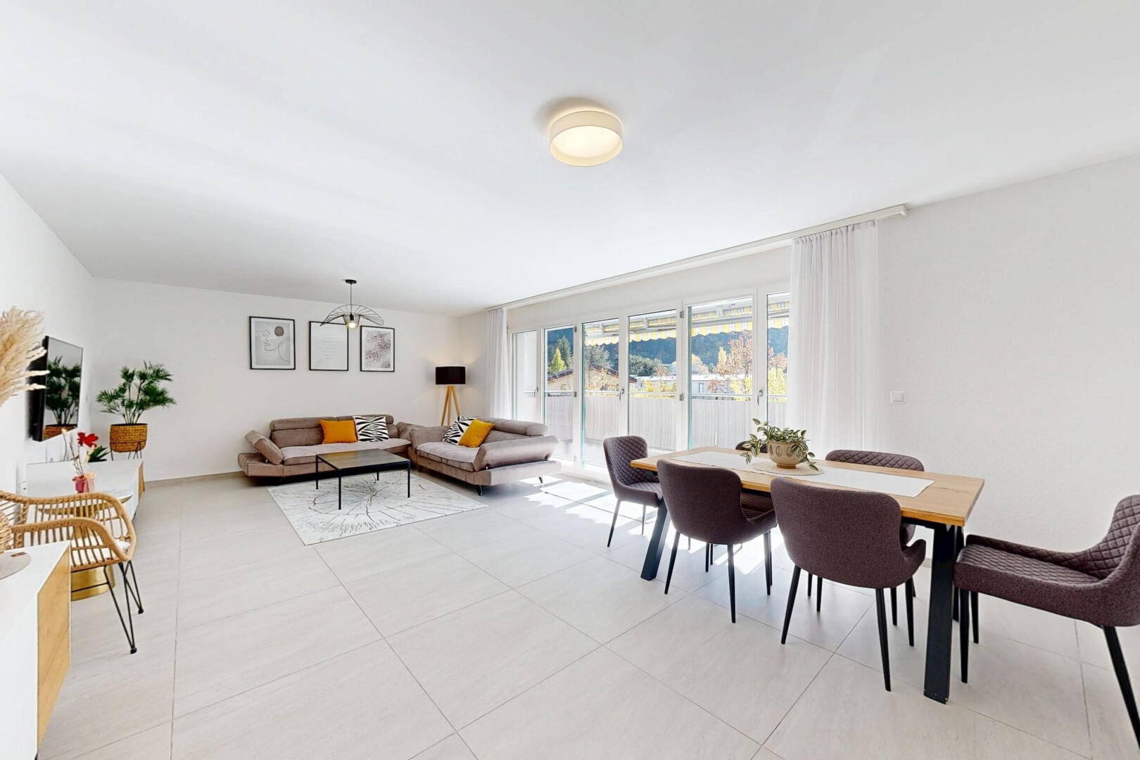 living / dining area with light tile patterned flooring