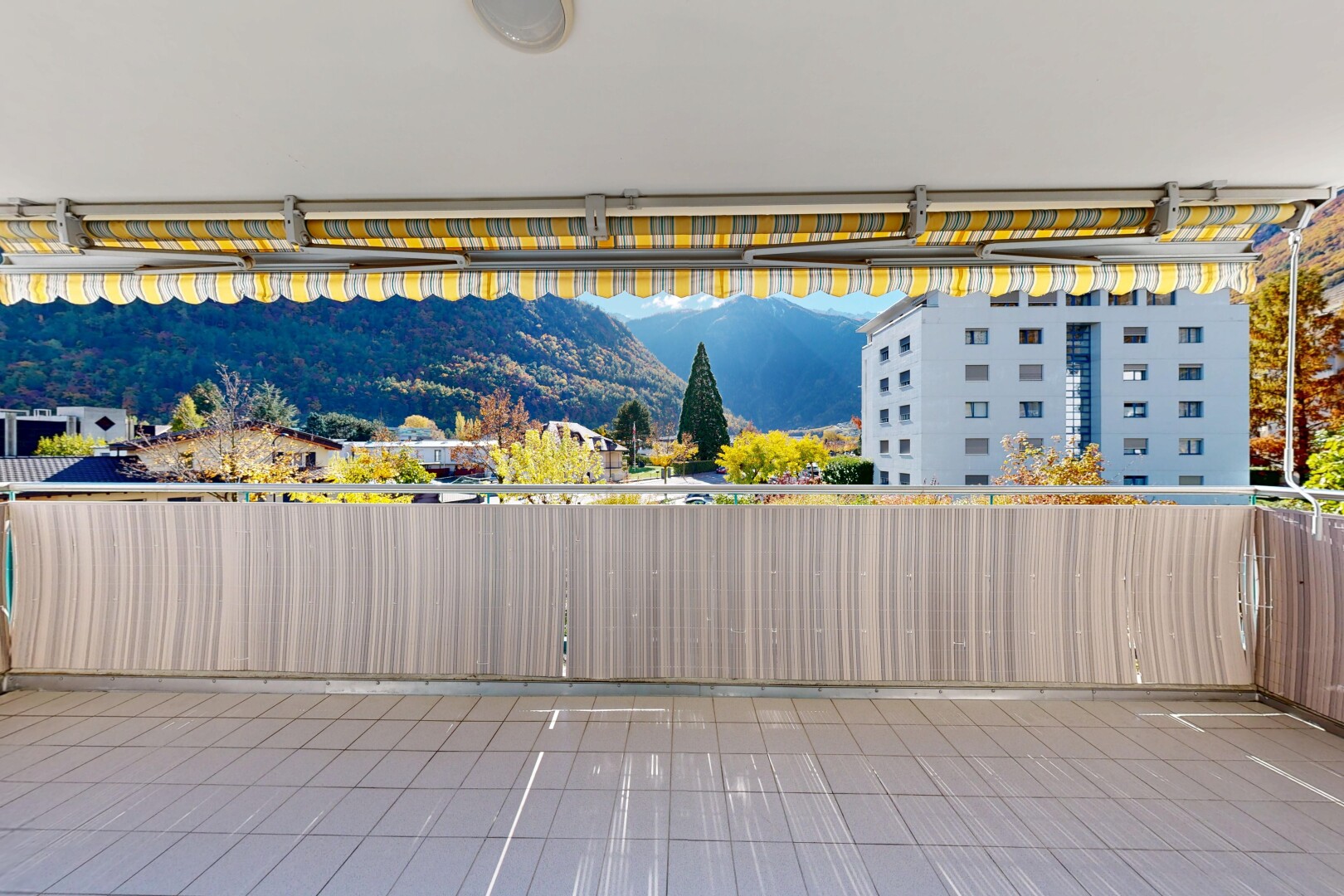terrace featuring a mountain view and a patio area