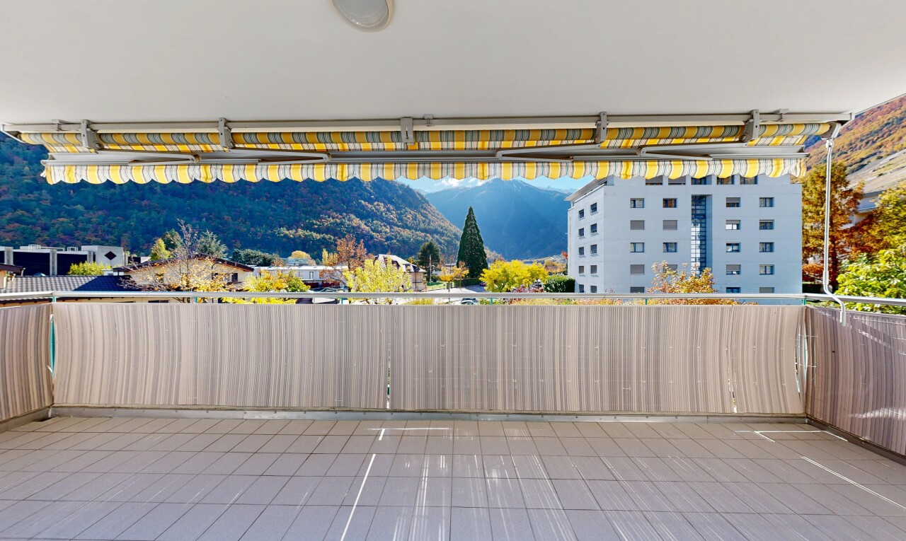 terrace featuring a mountain view and a patio area