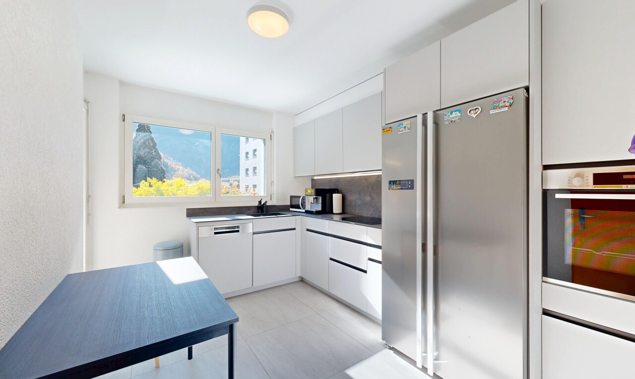 kitchen featuring stainless steel appliances, white cabinetry, dark countertops, backsplash, and modern cabinets