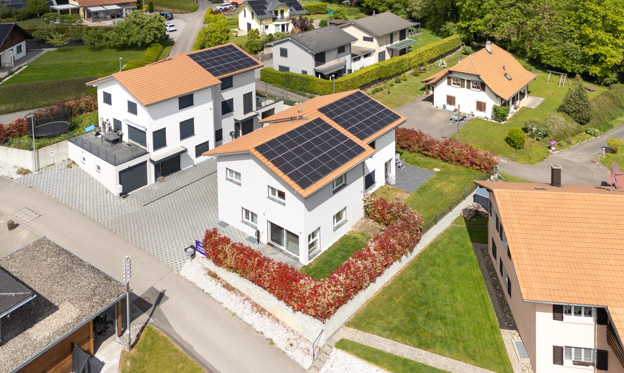outdoor house with roof mounted solar panels