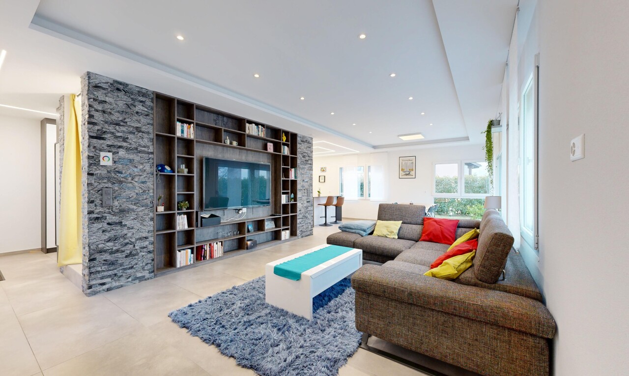 living room with tile patterned floors and recessed lighting