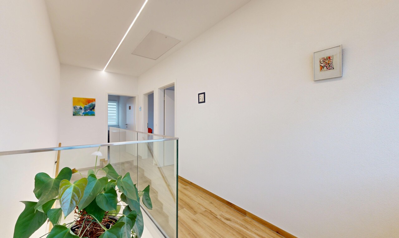 hallway with light wood-type flooring