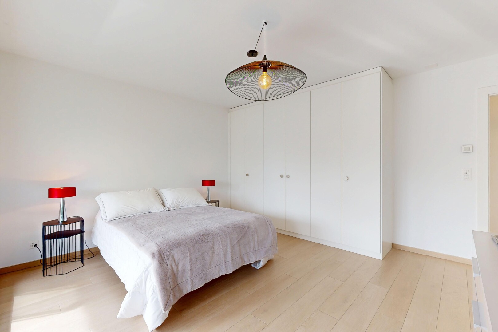 room / bedroom with light wood-type flooring and baseboards