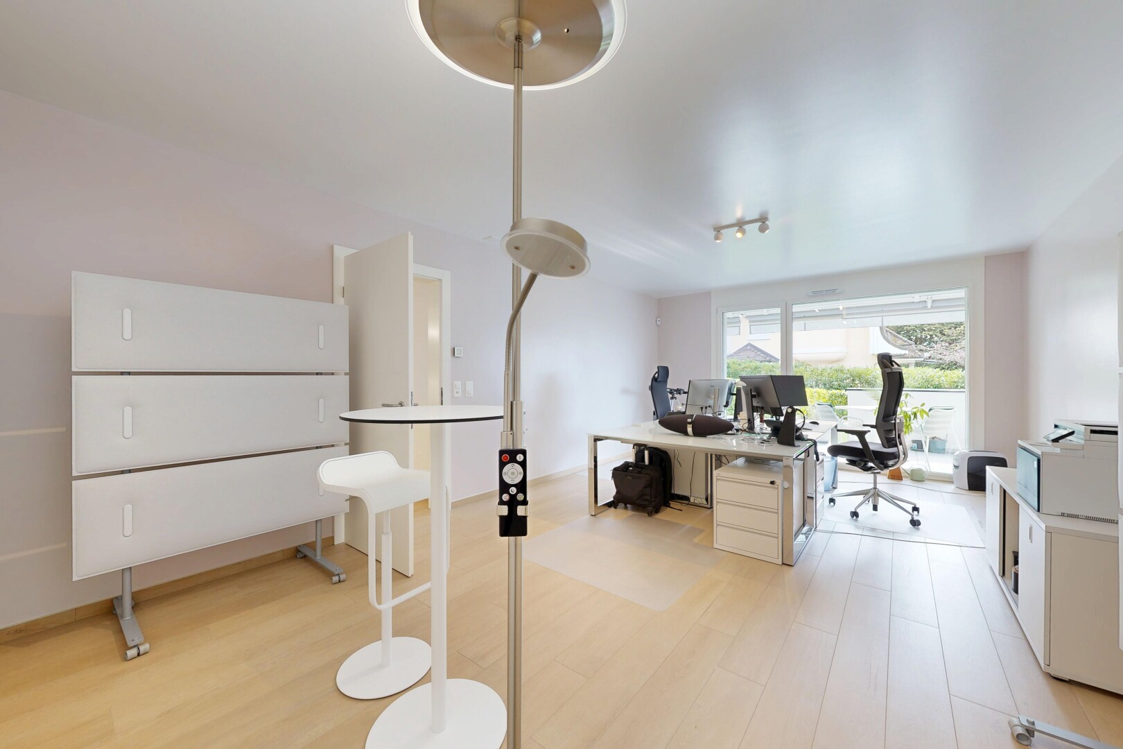 kitchen featuring an office area, light countertops, and light wood-style floors