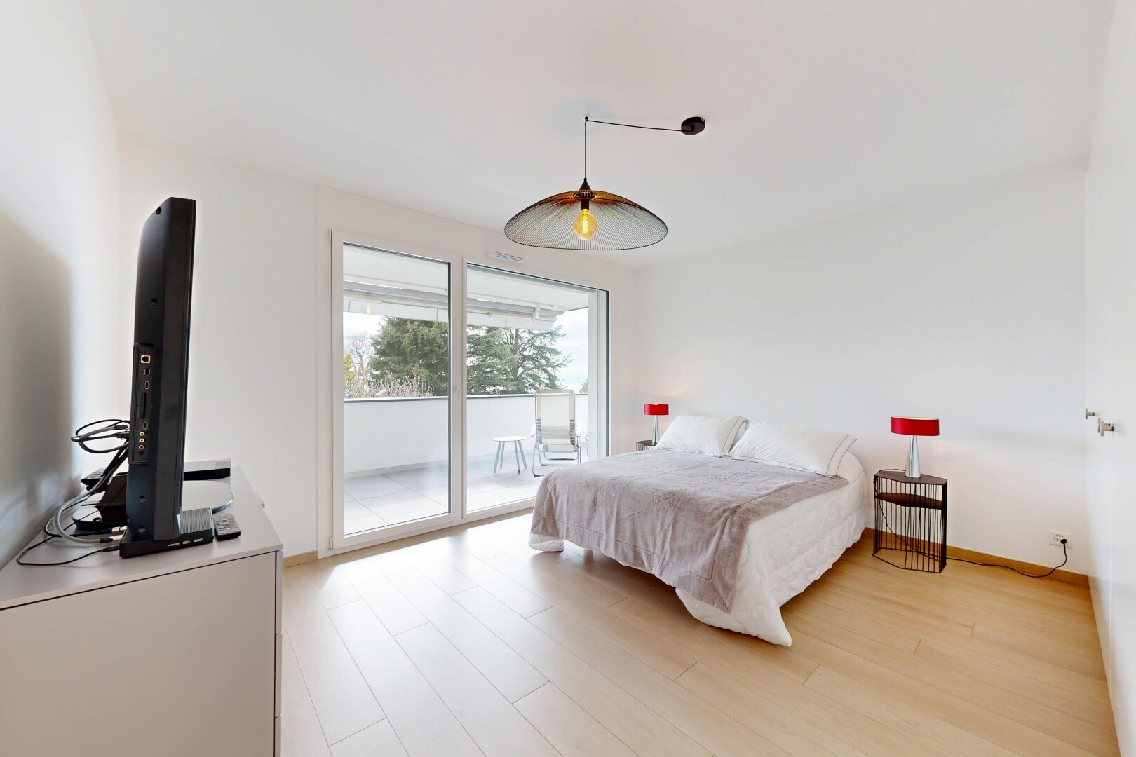 room with access to outside and light wood-style floors