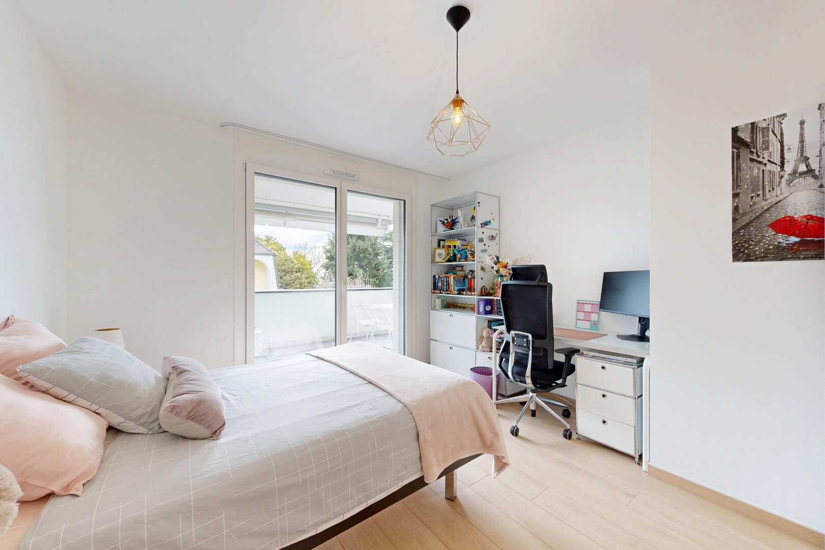 room featuring light wood finished floors and a desk