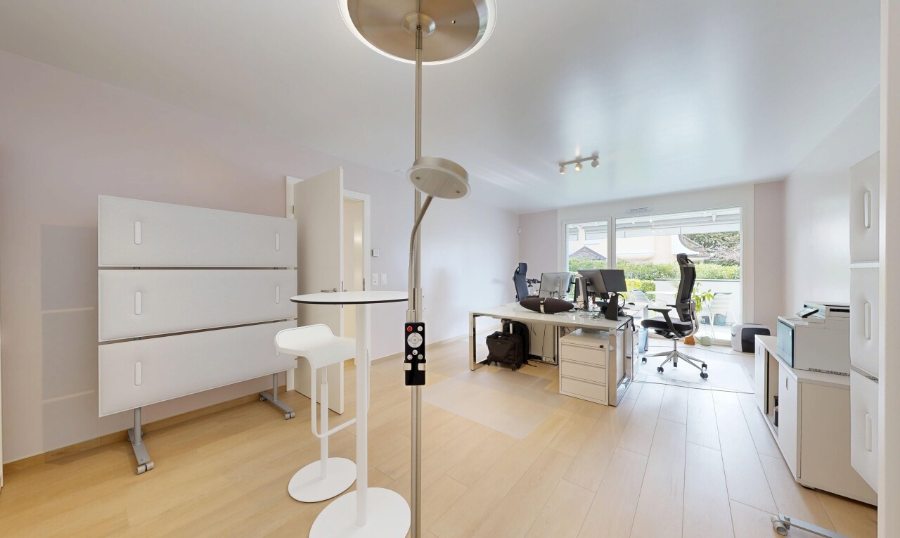 kitchen featuring an office area, light countertops, and light wood-style floors