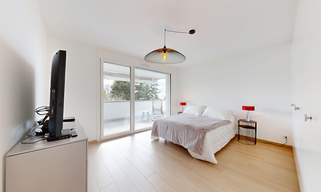 room with access to outside and light wood-style floors