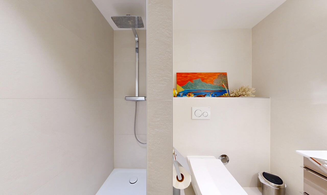 full bath with a walk in shower and vanity