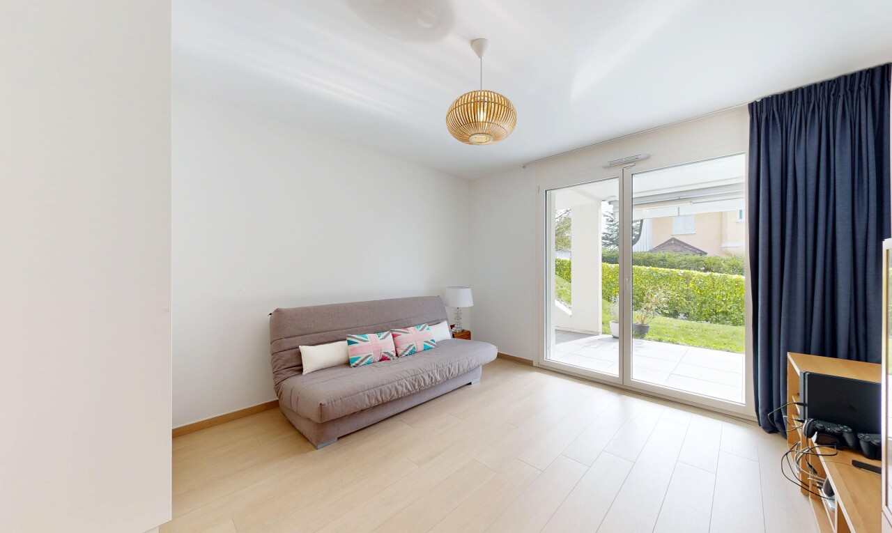 living room with light wood-type flooring and baseboards