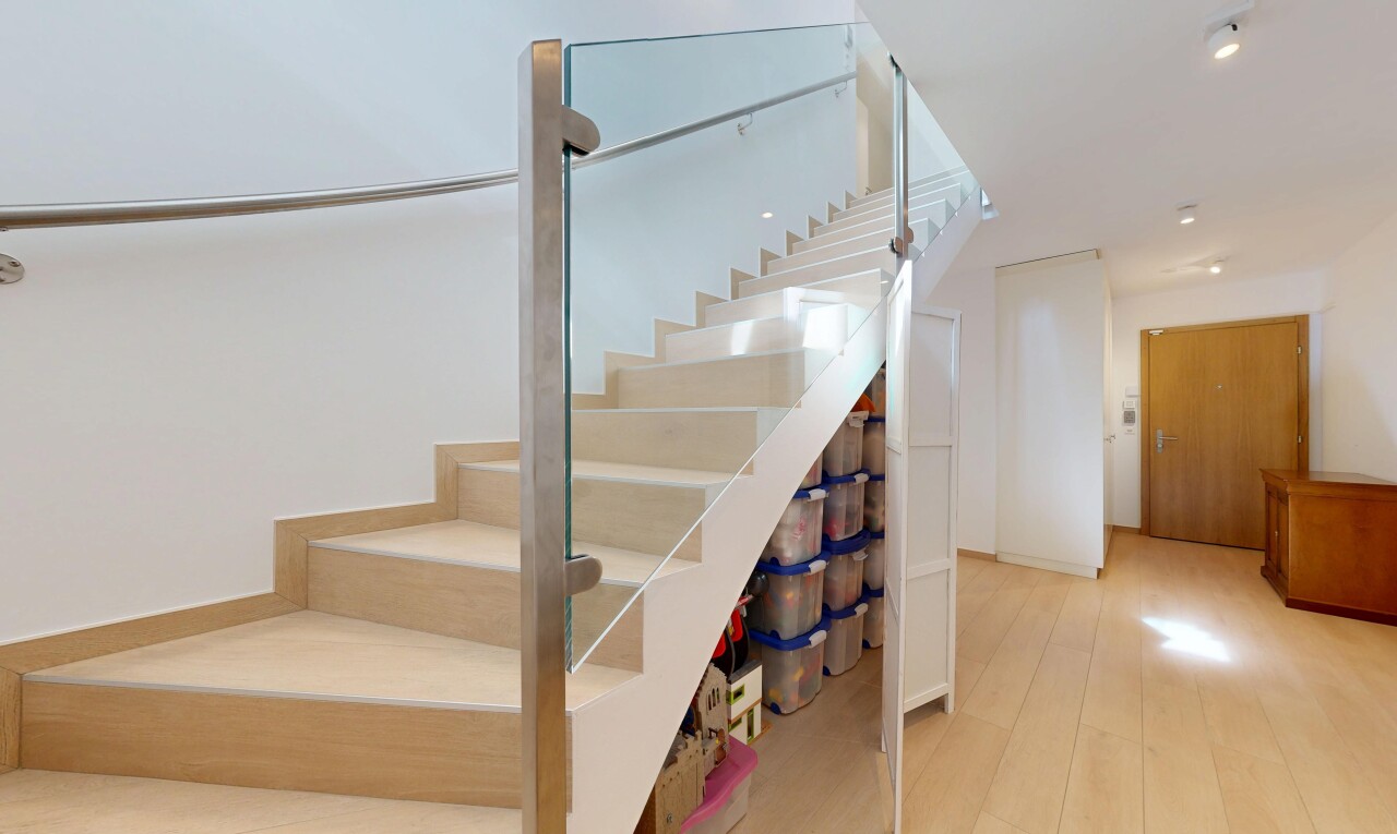 stairs featuring wood finished floors