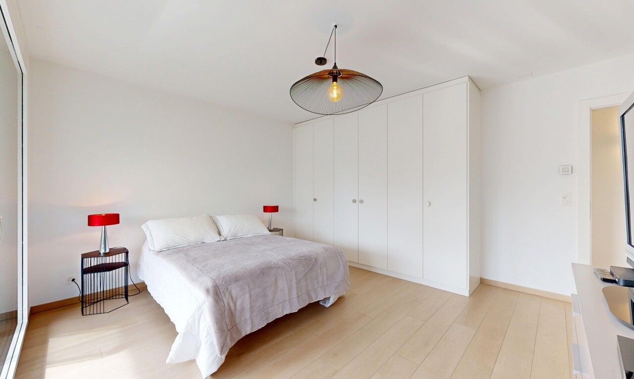 room / bedroom with light wood-type flooring and baseboards