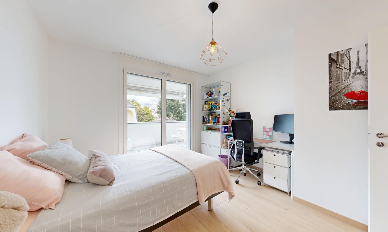 room featuring light wood finished floors and a desk