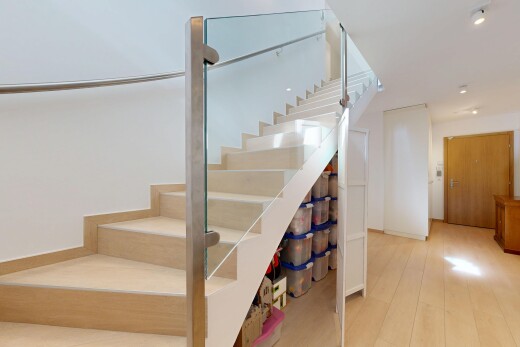 stairs featuring wood finished floors