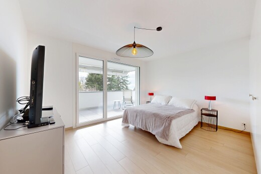 room with access to outside and light wood-style floors