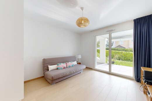 living room with light wood-type flooring and baseboards