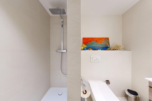 full bath with a walk in shower and vanity