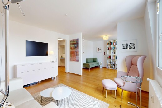 living room with radiator and light wood-style floors