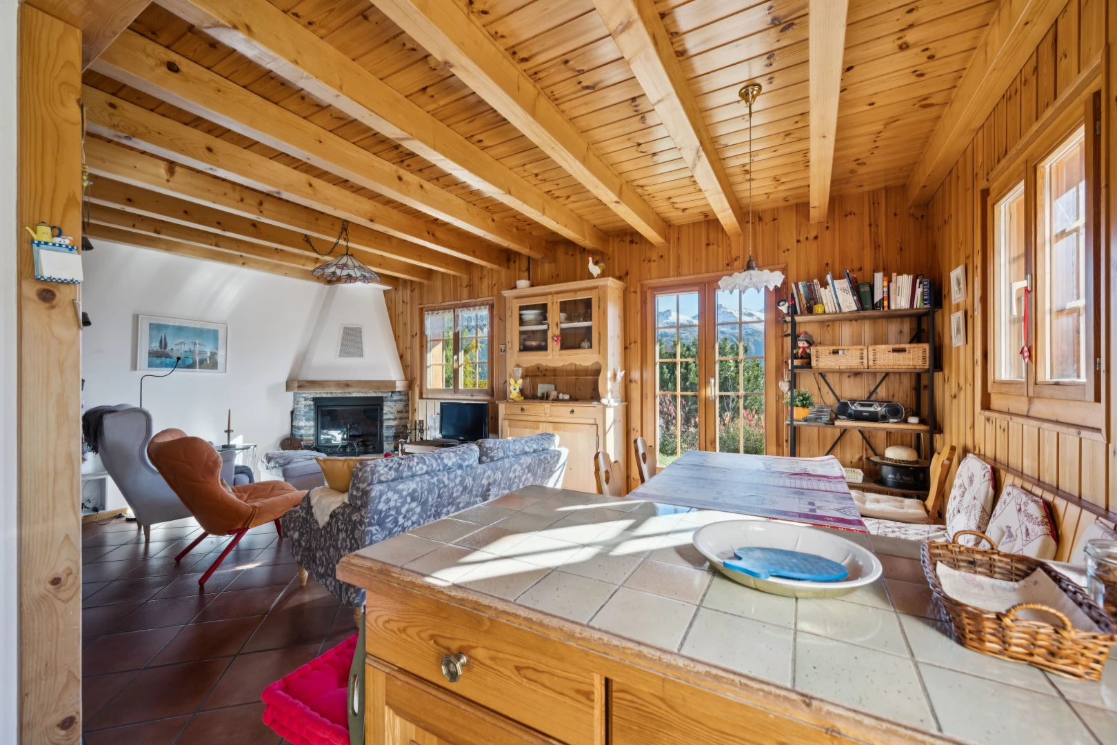 dining space featuring a wood ceiling with exposed beams, french doors, a fireplace, access to exterior, and wood walls