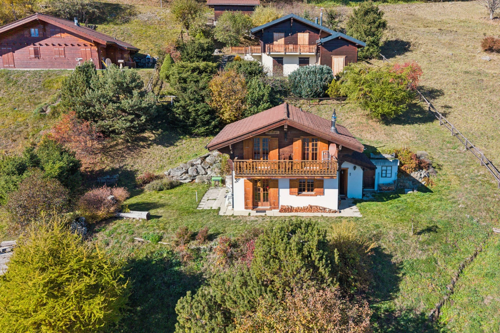 view of home featuring a yard and a balcony