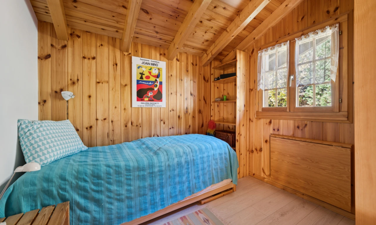 room / bedroom with wood ceiling, vaulted ceiling with beams, light wood-style flooring, and wood walls