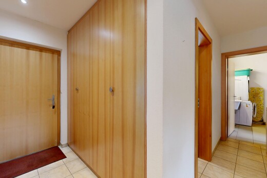 corridor featuring light tile patterned flooring