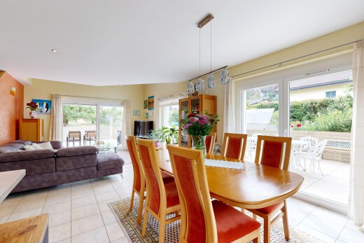 living / dining area featuring light tile patterned floors