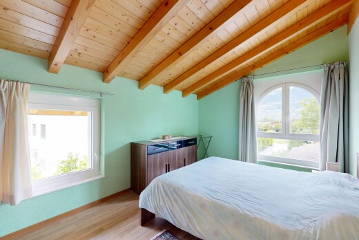 room with light wood-style floors, multiple windows, wood ceiling, and vaulted ceiling with beams