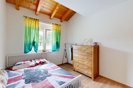 room featuring radiator, wood ceiling, light wood-type flooring, and lofted ceiling with beams