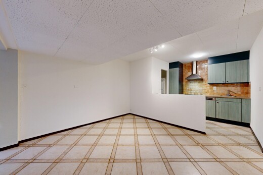 unfurnished room with a sink and baseboards