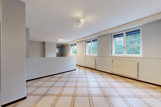 unfurnished room with baseboards