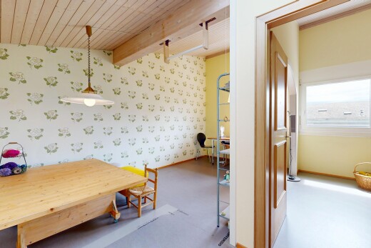 dining area with wallpapered walls, decorative light fixtures, and a wood ceiling with exposed beams