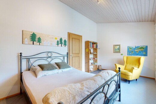 room with baseboards and a vaulted wooden ceiling
