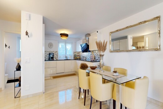 dining area with baseboards and light tile patterned floors
