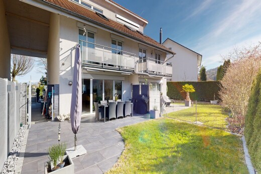view of home with a balcony, a fenced backyard, stucco siding, and a patio