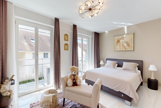 room featuring access to outside and suspended lighting