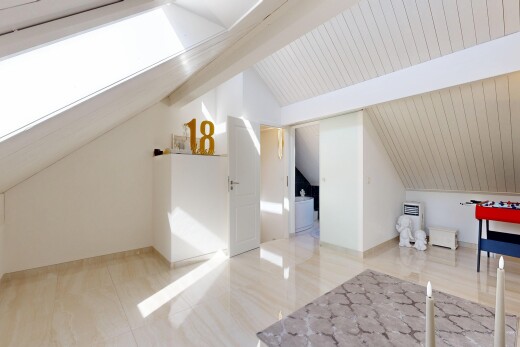 empty room with vaulted ceiling with beams and wooden ceiling