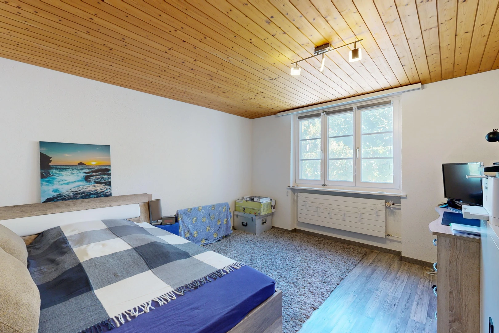 room / bedroom featuring wood ceiling, track lighting, and wood finished floors